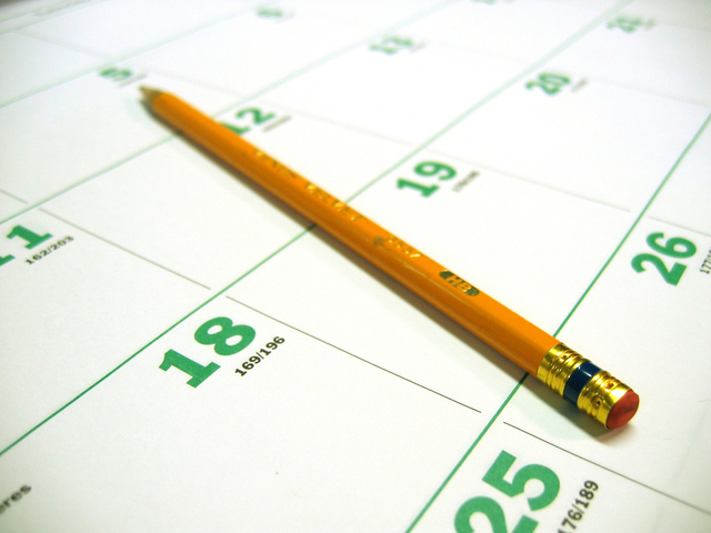 pencil sitting on desk calendar
